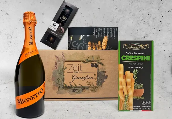 Sektgeschenke: Mionetto Prosecco, Pralinen, Tomaten-Biscuits und Rosmarin-Grissini. Perfekt für Genießer.