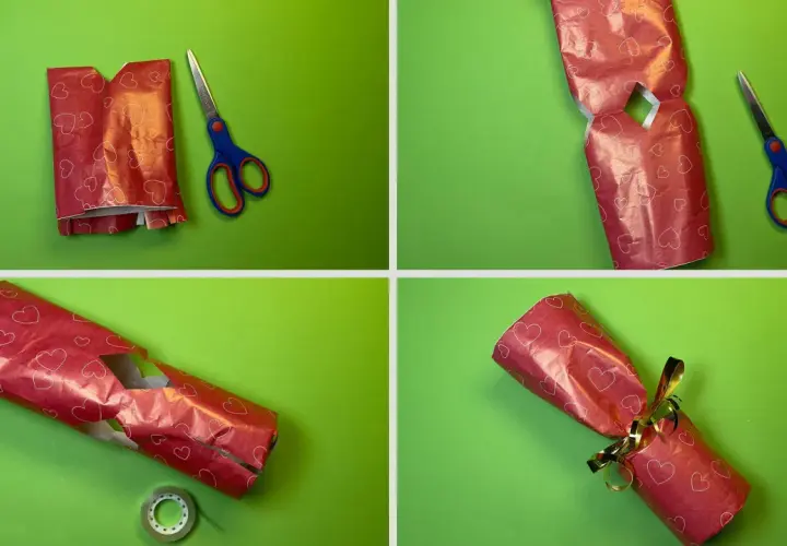 Schritt-für-Schritt-Anleitung: eine Kerze als Geschenk verpacken. Rotes Herz-Geschenkpapier wird zugeschnitten, gefaltet und mit Klebeband fixiert.