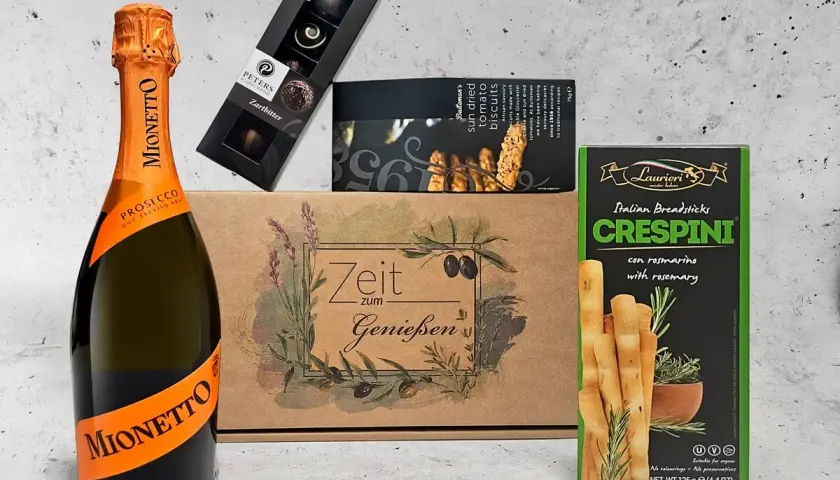 Sektgeschenke: Mionetto Prosecco, Pralinen, Tomaten-Biscuits und Rosmarin-Grissini. Perfekt für Genießer.