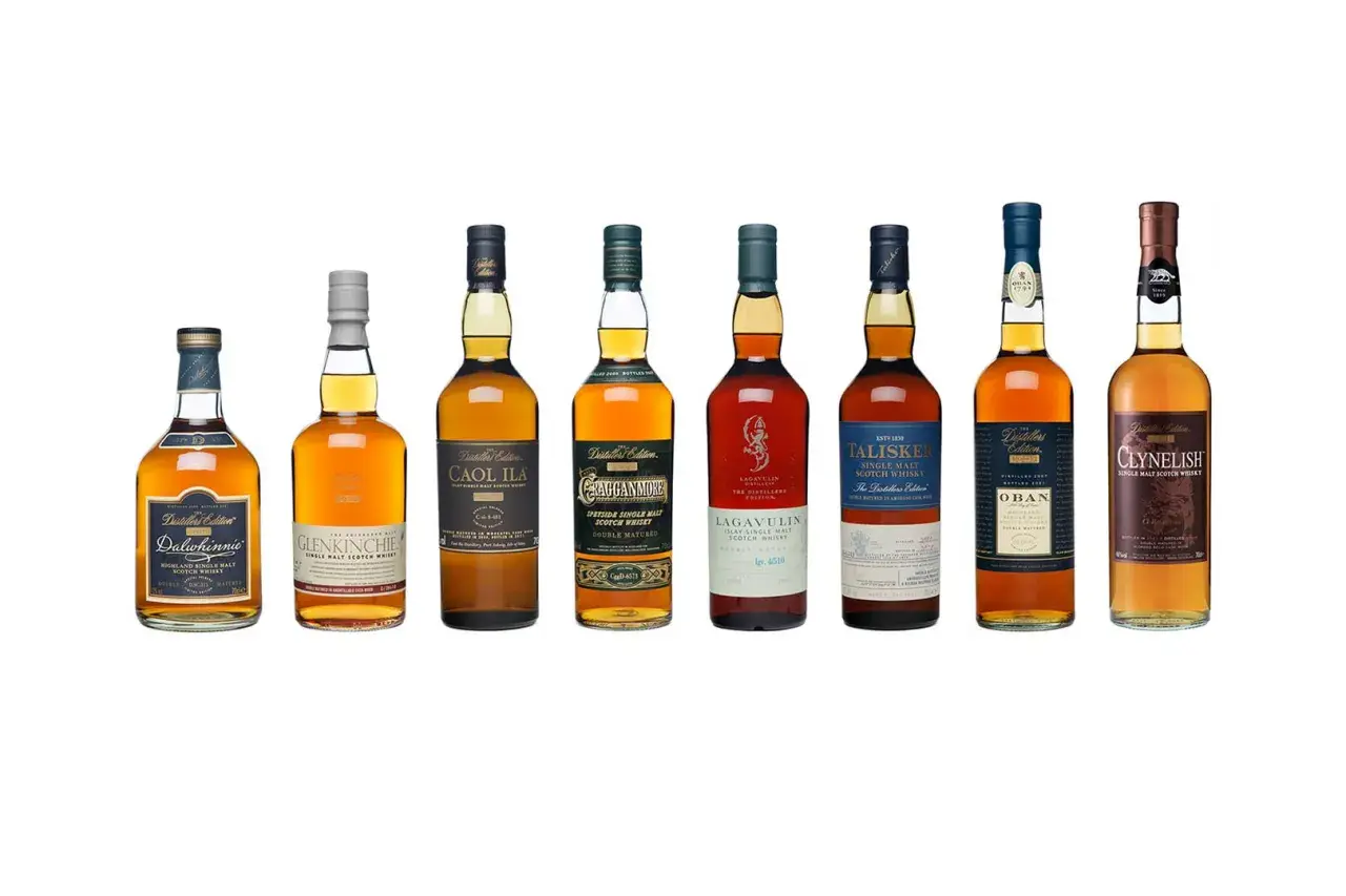 A row of eight bottles showcasing various gute whiskey sorten, including Dalwhinnie, Glenkinchie, Caol Ila, Cragganmore, Lagavulin, Talisker, Oban, and Clynelish.